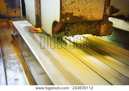 Grinding Of Metal On A Flat Machine Tool With Water Cooling. Metalworking Industry. Picture With Tin