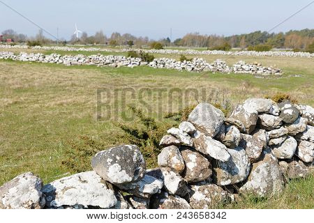 Traditional Stone Wall Made Of Lime Stone To Stop The Animals From Escaping Outside The City At Borg