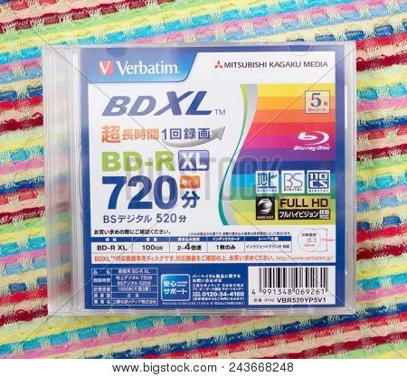 GOMEL, BELARUS - MAY 30, 2018: Mitsubishi (Verbatim) BD-R XL 100GB disc on a variocolor background. The Mitsubishi Group is a group of autonomous Japanese multinational companies.