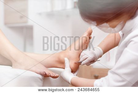 View Of Procedure Of Cleaning Foot With Iron Tool In Podiatrist Cabinet. Profeesional Doctor Polish 