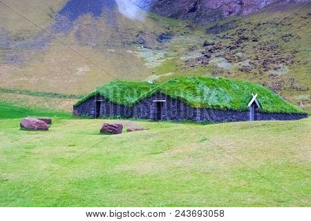 House With Grass Roof In Heimaey, Iceland. Green And Eco House Architecture. Ecology And Environment