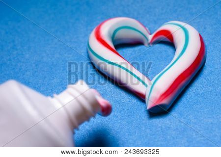 Healthy Teeth. Hygiene Of The Oral Cavity. Colored Toothpaste From A Tube. Pasta In The Form Of A He