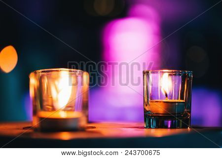 Candles In Spa Zone With Beautiful Relaxing Liight And Dlurry Colorful Backdrop.