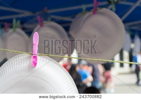 Paper Plates Hanging On Rope With Clothespins