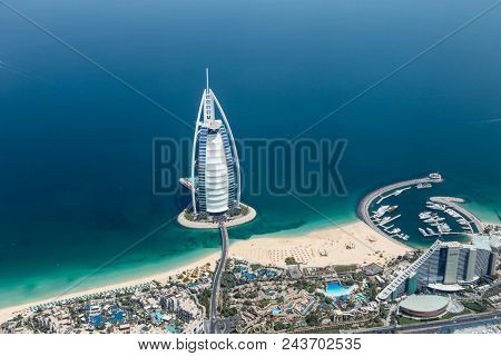 DUBAI, UAE - MAY 28: Burj Al Arab hotel on May 28, 2018 in Dubai, UAE. Burj Al Arab is a luxury unofficial 7star hotel built on an artificial island in front of Jumeirah beach. View from hydroplane.