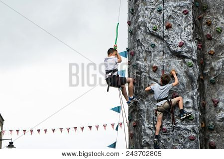 Bedford, Bedfordshire, Uk, June 2, 2018.young Boys Climbing Wall.