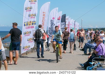 Zelenogradsk, Kaliningrad Region, Russia - July 29, 2017: Unknown People Walking On The Coast Of The