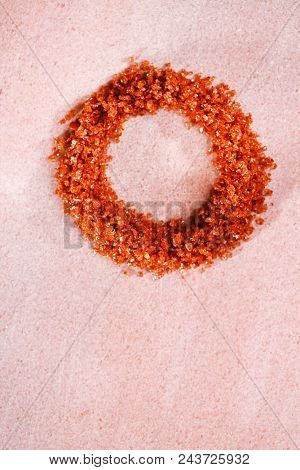 Hawaiian Red Gold Salt in circle shape on pink marble