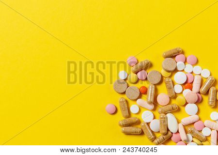Medication White Colorful Round Tablets Arranged Abstract On Yellow Color Background. Aspirin, Capsu