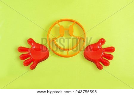 Forms For Baking In Shape Of Face With Smile And Hands On Lemon Background. Minimal Style. Creative 