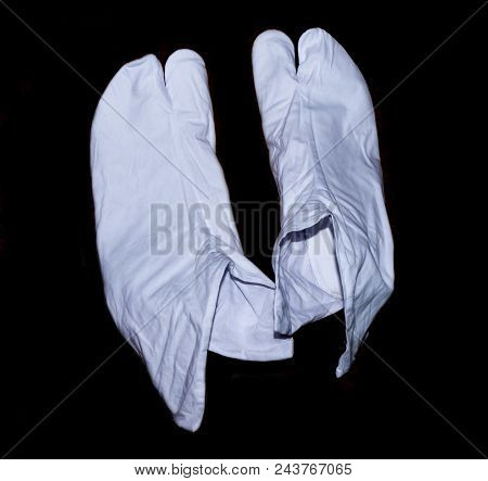 The Japanese tabi on a black background.