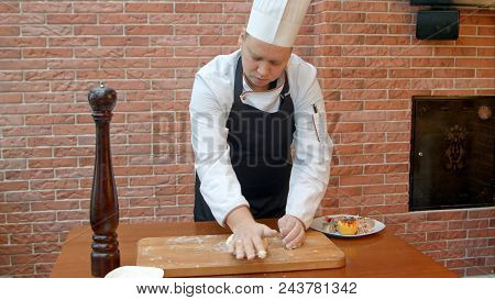 Chef Kneading A Dough. Professional Shot In 4k Resolution. 084