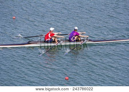 Two Young Rowers In A Racing Rower Boat