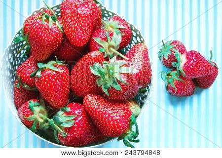 Strawberries In A Basket On A Bright Blue Background, The Top View