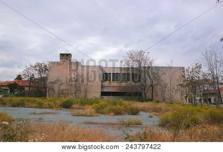 Detail Of An Abandoned Building In Cloudy Sky Landscape