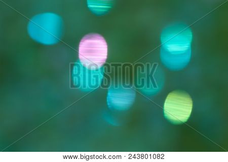 Bokeh Background. Dark Green Blue Background With Blurred Stripy Spheres In Bright Turquoise Blue, P