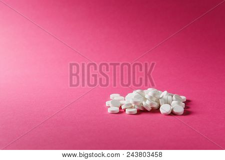 Medication Pile White Round Tablets Arranged Abstract On Pink Rose Color Background. Aspirin, Capsul