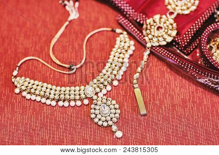 Glitter Necklet With Pearl Of Indian Bride On Red Background