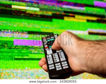 Man With Large Tv Remote Trying To Fix The Digital Television Noise On A Large Plasma Oled 4k Ultra 