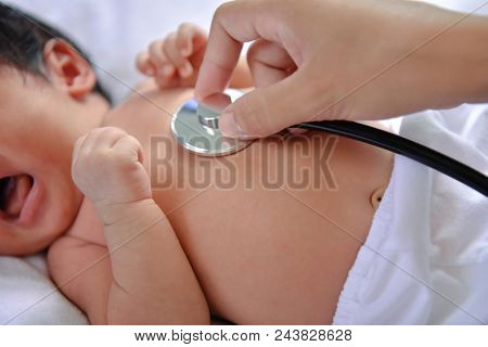 Baby Sick Concept. The Doctor Is Examining The Baby's Illness.