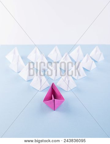 One Unique Pink Paper Boat Among Many Ones. Different Paper Ships As Individuality And Leadership Co