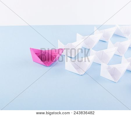 One Unique Pink Paper Boat Among Many Ones. Different Paper Ships As Individuality And Leadership Co