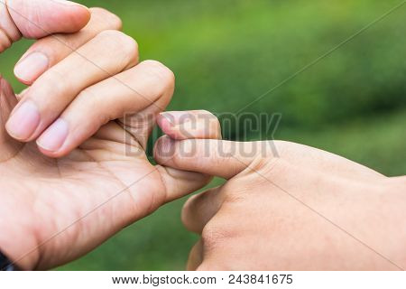 Promise Concept. Close Up Hands Of Couple Hooking Each Other's Little Finger Together.
