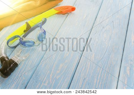 Glasses Diving Mask And Snorkel On Wooden Blue Background