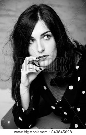 Trendy attractive woman portrait. Studio, isolated on grey rustic background.