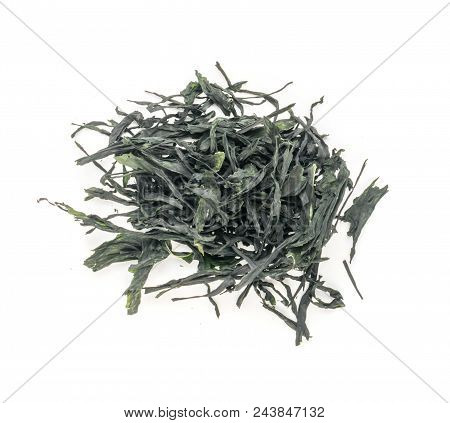 Heap Of Dry Wakame Seaweed Isolated On White Background. Healthy Algae Food