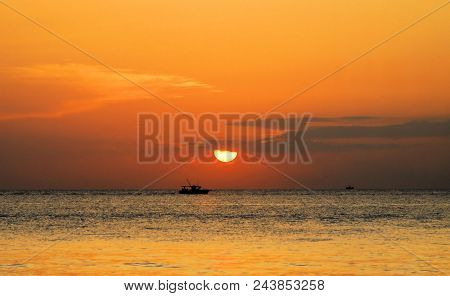 Fishing Boat At Sunrise Off The Atlantic Coastline Near Boynton Beach, Florida