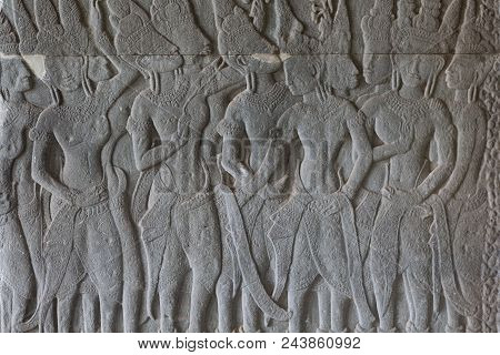 Stone Bas-relief With Human Figures In Angkor Wat Temple, Siem Reap, Cambodia. Male Figures Stone Ca