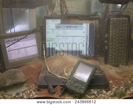 Protected Notebook, Pda And Tablet In The Sand