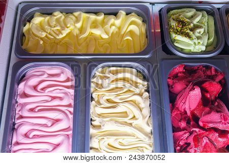 Delicious Ice Cream Of Different Flavors And Colors On A Confectionery Shop