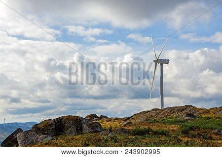 Wind turbine generator on top a hill for the production of clean and renewable energy near Fafe, Portugal