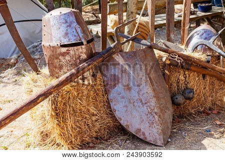 Obidos, Portugal - August 09, 2015: Medieval weapons and armor replicas at the very popular Medieval Market in Obidos. Obidos is a medieval town inside walls, and very popular among tourists.