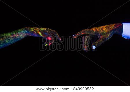 Concept Of Connecting Hands Creative Shooting In Neon Light Male And Female Palms Together