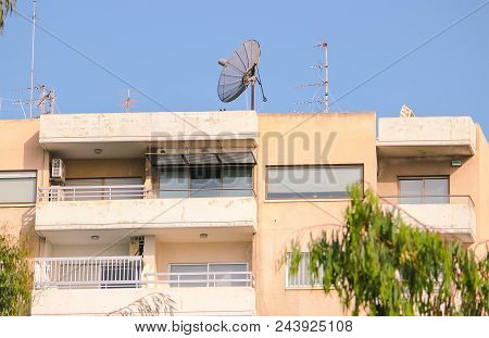 Detail Of Building In Cloudy Sky Landscape