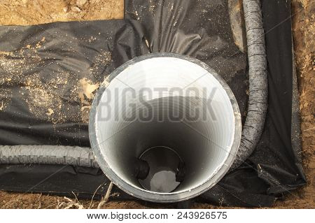 Close Up Top View Of Drainage Pipes And Inspection Well For Removal Of Water From A Site Under Const