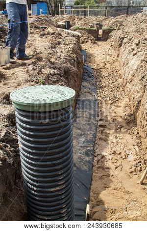 View Of Drainage Pipes And Inspection Well For Removal Of Water From A Site Under Construction Of Th