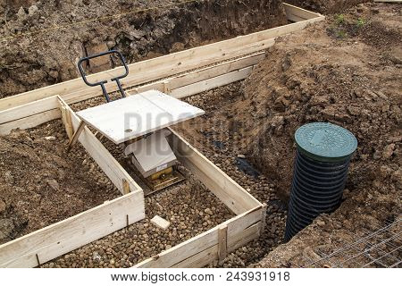 Inspection Well, Drainage Pipe And Trench With Formwork, Which Is Prepared For Pouring The Foundatio