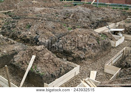 Inspection Well, Drainage Pipe And Trench With Formwork, Which Is Prepared For Pouring The Foundatio