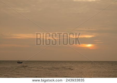 A Boat In The Sea During The Sunset Time