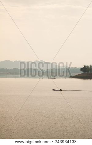 The Sailing Boat In The Sea During The Sunset