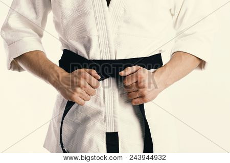 Karate Man. Brutal Man. Male Torso And Sportive Arms On White Background. Guy Poses In White Kimono 