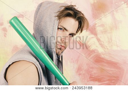 Brave Man. Brutal Man. Guy In Grey Sleeveless Hoodie Holds Bright Green Bat. Street Gangster With Co