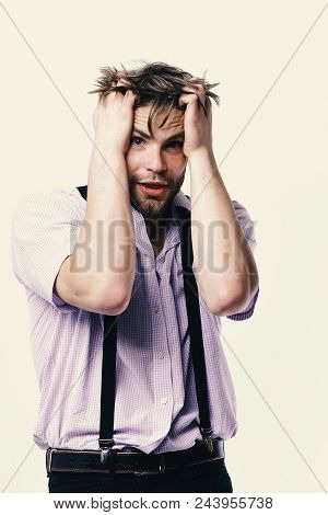 Man Or Student With Bristle And Scared Face In Plaid Shirt. Nerd Or Bookworm Wearing Suspenders. Ner