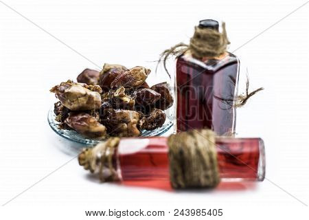 Sweet And Floral Essence Of Date Or Khajoor In Bottles Isolated On White Used In Flavored Chocolate 