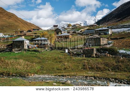 Mountain Enguri River Against Caucasian Chvibiani Village In Ushguli Commune, Caucasus, Upper Svanet