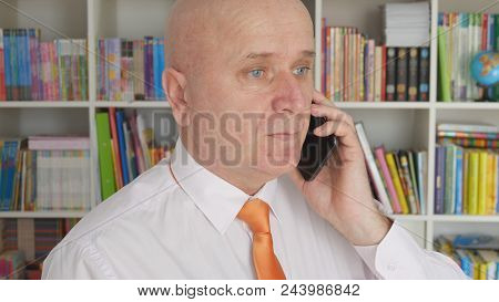 Businessman In Office Room Image Using Mobile Phone